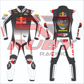 Front and back view of the Augusto Fernandez Red Bull Gasgas racing suit for the 2024 British GP. The suit is predominantly white with black and red details, featuring logos from sponsors like Red Bull, GASGAS, Motul, Michelin, and Tech3. The design includes protective knee and elbow sliders, with the rider's initials 'AF37' displayed on the back.