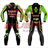 Front and back view of the Axel Bassani Kawasaki Racing Team suit for the 2024 WSBK season. The suit is primarily black with vibrant green and yellow accents, featuring the Kawasaki Racing Team logo on the chest. Sponsor logos, including Motul, Shoya, and Ruby, are displayed on the arms, shoulders, and legs. The design includes protective knee and elbow sliders, with the Ninja logo visible on the back