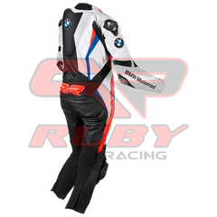 Side view of the BMW Double R Men's Motorbike Race Suit. The suit features white, black, red, and blue accents with prominent BMW Motorrad branding on the chest and sleeves. Designed for racing, it includes padded protection on the shoulders, elbows, and knees, combining safety with a sleek, aerodynamic design
