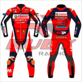 Front and rear views of the 2025 Luca Marini MotoGP Honda Castrol leather race suit by RUBY. Features red, black, and navy design with sponsor logos from Castrol, VR46, MotoGP, and Michelin. Includes custom knee armor with 'M' branding and MARINI name on the back.