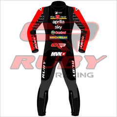 Back view of the 2024 Maverick Viñales Aprilia Racing suit design for British GP featuring a black, red, and white color scheme with prominent sponsor logos like Aprilia, Sky, Michelin, and Ruby. The suit showcases detailed graphics on the legs and arms, personalized for Maverick Viñales.