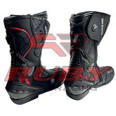 Front view of BMW Motorrad red black motorcycle boots showing full-grain leather finish, shin protection, and flexible accordion stretch panels.
