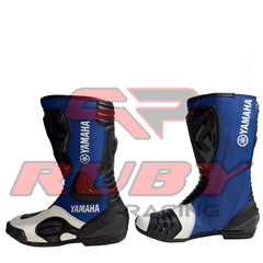 Yamaha blue racing boots with white highlights, reinforced toe sliders, and ergonomic padding for professional-level comfort.
