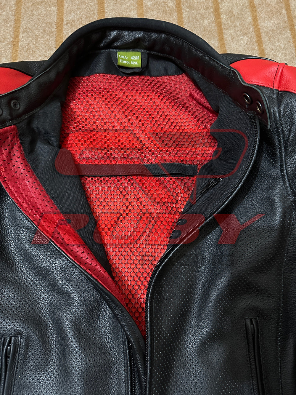 Closeup View of Ducati C4 Motorcycle Leather Jacket – Black and Red Design Featuring Ducati Logo, Premium Perforated Leather, and Stylish Fit for Riders