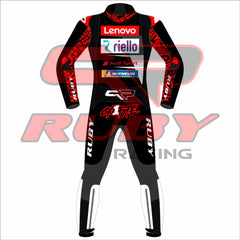 Francesco Bagnaia Ducati Motorcycle Riding Suit BritishGP 2024. The suit is predominantly black with red and white accents, featuring sponsor logos such as Lenovo, Monster, and NetApp. The design includes matching gloves and boots, emphasizing a professional and cohesive look for motorsport racing.