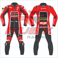 Franco Morbidelli's 2024 Pramac Race Suit for the British GP, shown in front and back views. The suit is predominantly red with 'PRIMA PRAMAC DUCATI' branding on the chest, complemented by sponsor logos including Michelin, FIAMM, and the number 89. The back features a black panel with additional logos, including 'PRIMA PRAMAC' and 'MICHELIN.' The suit includes protective padding at the knees and elbows, designed for optimal safety during high-speed racing events.