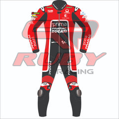 Front view of Franco Morbidelli's 2024 Pramac Race Suit for the British GP. The suit is predominantly red with black and white accents, featuring prominent 'PRIMA PRAMAC DUCATI' branding on the chest. Sponsor logos such as Michelin, FIAMM, and Akrapovic are visible on the shoulders and arms, with the number 89 on the left shoulder. The suit has black leg panels with 'PRAMAC' branding in white and protective knee pads integrated for added safety