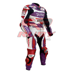 Side angle view of the 2023 Ducati Pramac MotoGP Racing Leather Suit worn by Jorge Martin. Featuring a purple, red, and white color scheme with sponsor logos such as Prima, Pramac, and Ducati. The suit includes reinforced padding on the knees and elbows for enhanced protection during high-performance motorcycling