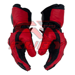 Side view of the Jorge Martin MotoGP 2024 Race Gloves in red and black. The gloves highlight the ergonomic design and reinforced finger sections, providing maximum comfort and protection. The durable leather construction and secure wrist straps make these gloves ideal for professional racing, ensuring a snug fit and enhanced grip during high-speed maneuvers