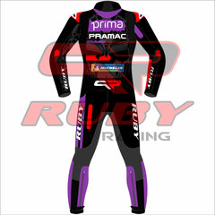 Back view of Jorge Martin's MotoGP racing suit from the Barcelona winter test. Features a bold design with black, purple, red, and white accents, sponsor logos from Pramac Racing and Ducati, and protective padding on knees and elbows. Number 89 is displayed prominently on the suit."