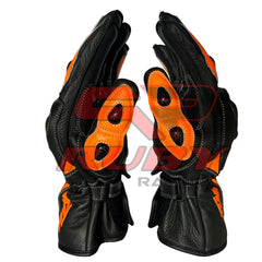 KTM Red Bull racing gloves in black and orange with reinforced knuckles, durable leather construction, and bold KTM branding. Designed for superior grip and protection, perfect for motorcycle enthusiasts.