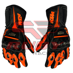 KTM Red Bull racing gloves in black and orange with reinforced knuckles, durable leather construction, and bold KTM branding. Designed for superior grip and protection, perfect for motorcycle enthusiasts.