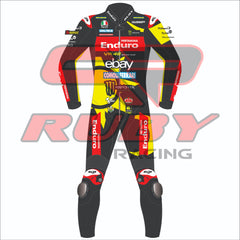 Front view of the 2024 Marco Bezzechi VR46 Pertamina Enduro racing suit for the British GP, featuring vibrant yellow and black design, sponsor logos, and Ruby branding.