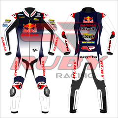 Front and back view of the Pedro Acosta Red Bull Gasgas racing suit for the 2024 British GP. The suit is predominantly white with black and red details, featuring logos from sponsors like Red Bull, GASGAS, Motul, Michelin, and Tech3. The design includes protective knee and elbow sliders, with the rider's initials 'acosta' displayed on the back.