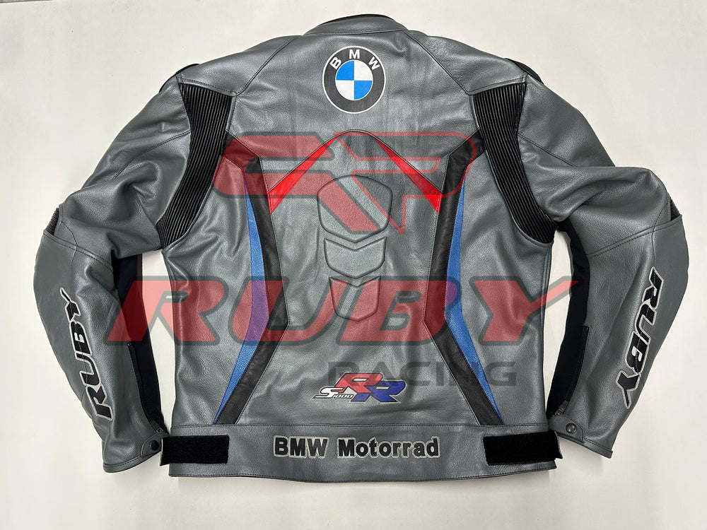 Back view of the BMW Motorrad Racing Motorcycle Jacket. The gray leather jacket features a large BMW logo centered at the upper back, with red and blue accents, along with the 'BMW Motorrad' branding and SBK logo near the waist. Designed for motorcycle riders, offering a stylish and protective fit.