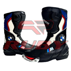 Front angle of BMW Motorrad motorcycle boots in black and blue design, showing steel toe sliders, flexible leather panels, and CE-certified protection.