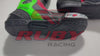 Aprilia RSV4 men motorbike leather boots showing red, green, and black panels with protective ankle sliders and racing-style design.