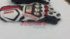 A pair of Ducati Corse racing motorbike gloves with a black, white, and red color scheme. The gloves feature protective metallic knuckle armor and padded fingers. The Ducati logo is prominently displayed on the top of each glove