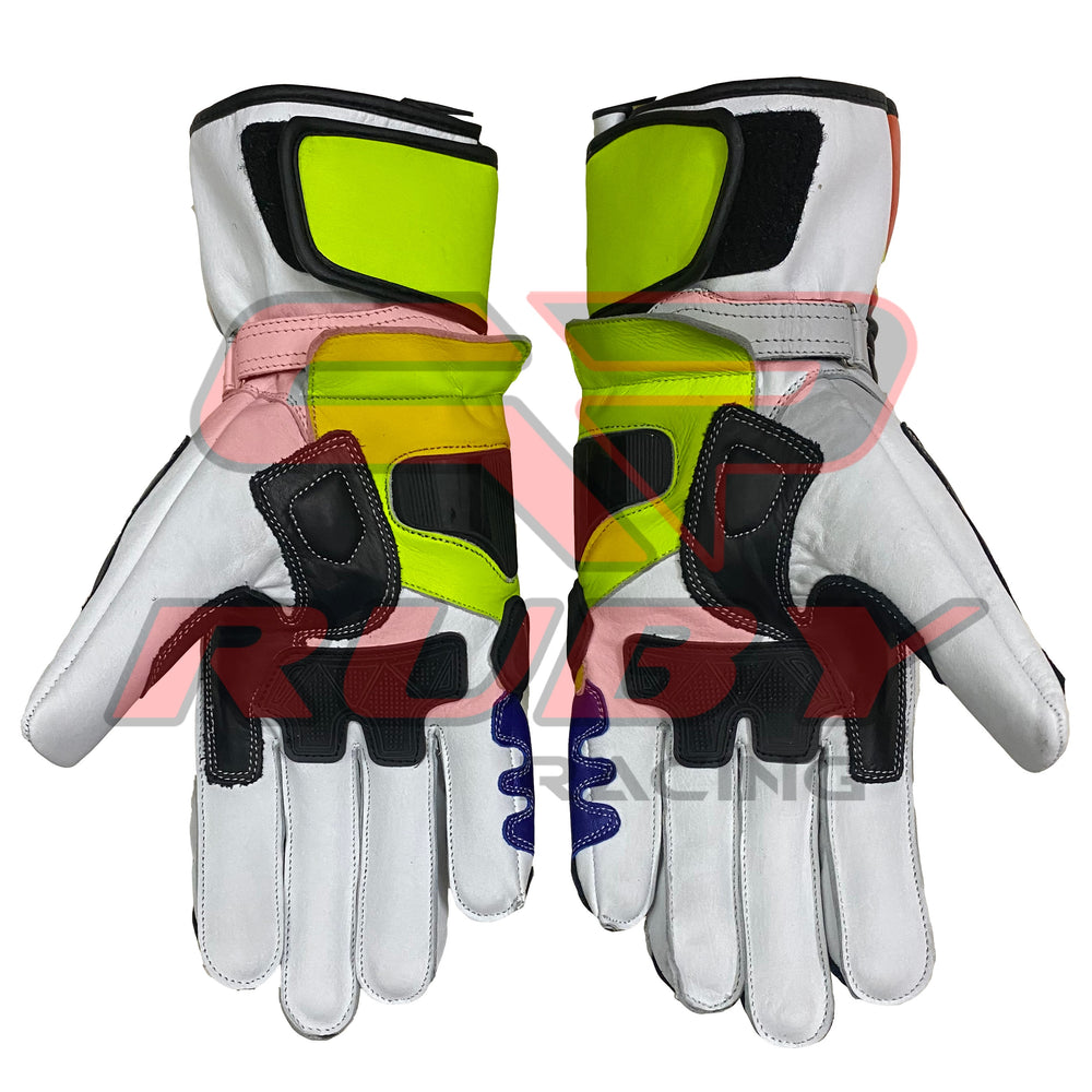 Back and palm view of a pair of Valentino Rossi 2016 MotoGP racing gloves, showcasing their vibrant yellow, blue, red, and black color scheme. The gloves feature reinforced protective padding, ergonomic stitching, and high-grip material on the palms, designed for both safety and performance during racing.