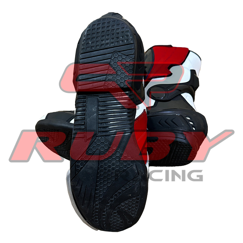 Underside view showing durable sole pattern and traction grip of Yamaha red and white racing boots.